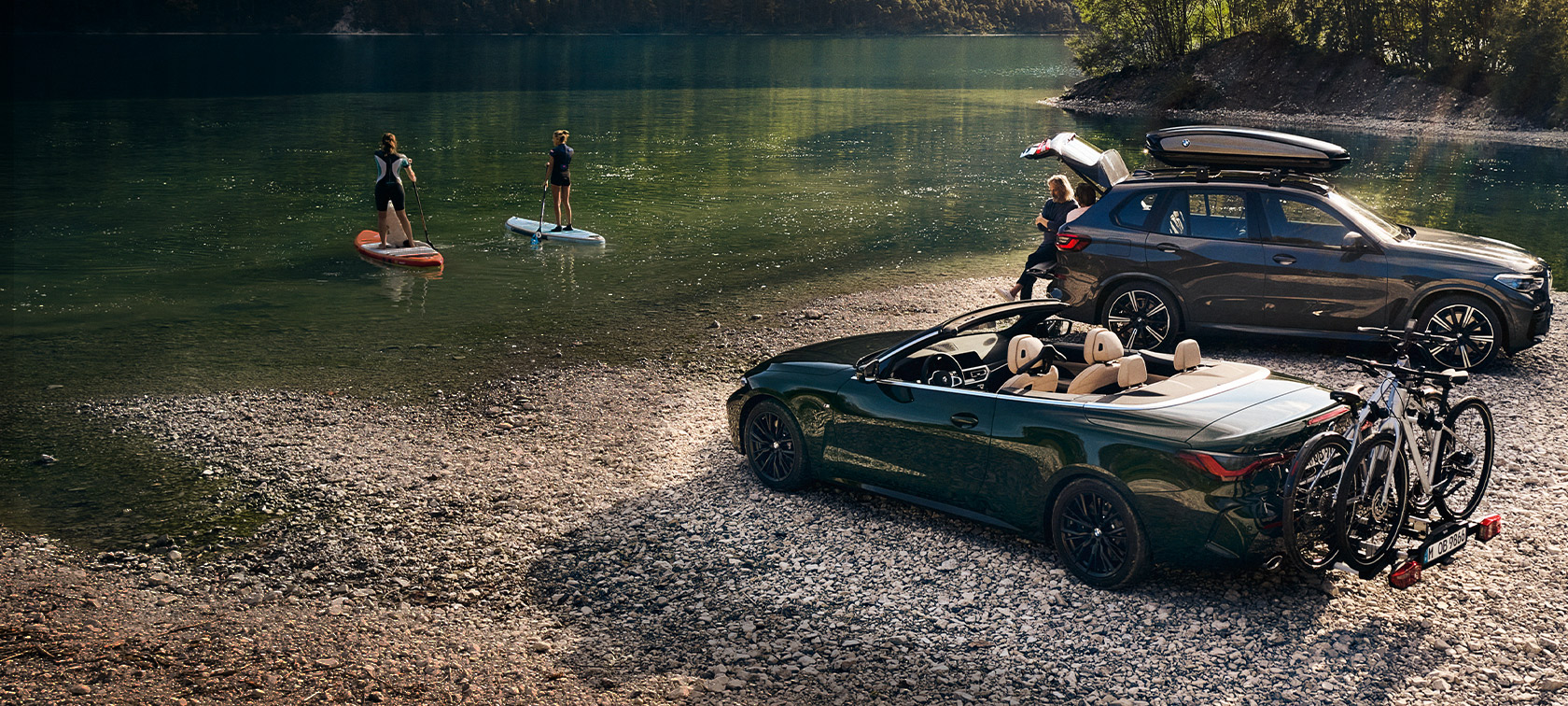 BMW Spring Summer Accessories BMW vehicles in front of lake and green landscape